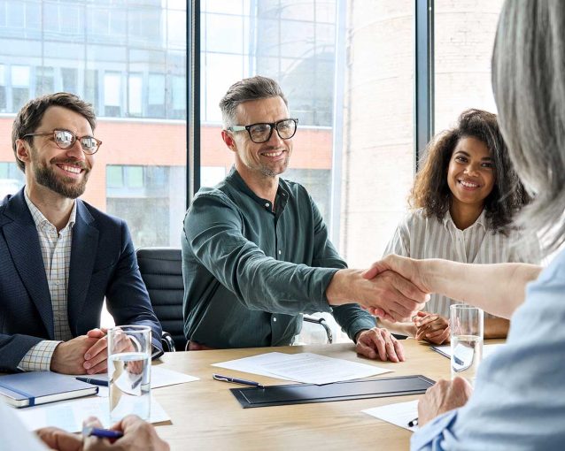happy-businessman-and-businesswoman-shaking-hands-MSHPBAB